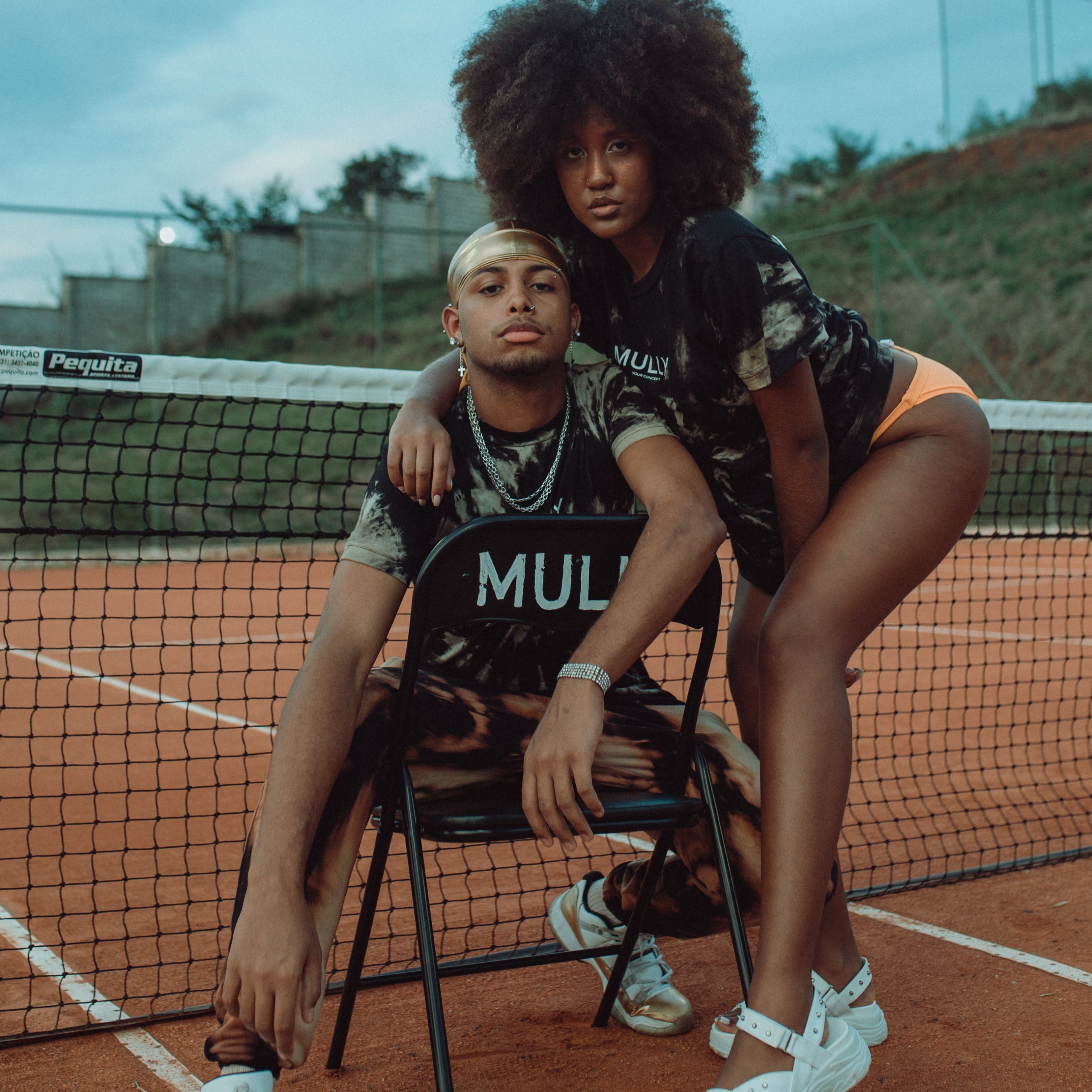 two people tennis court